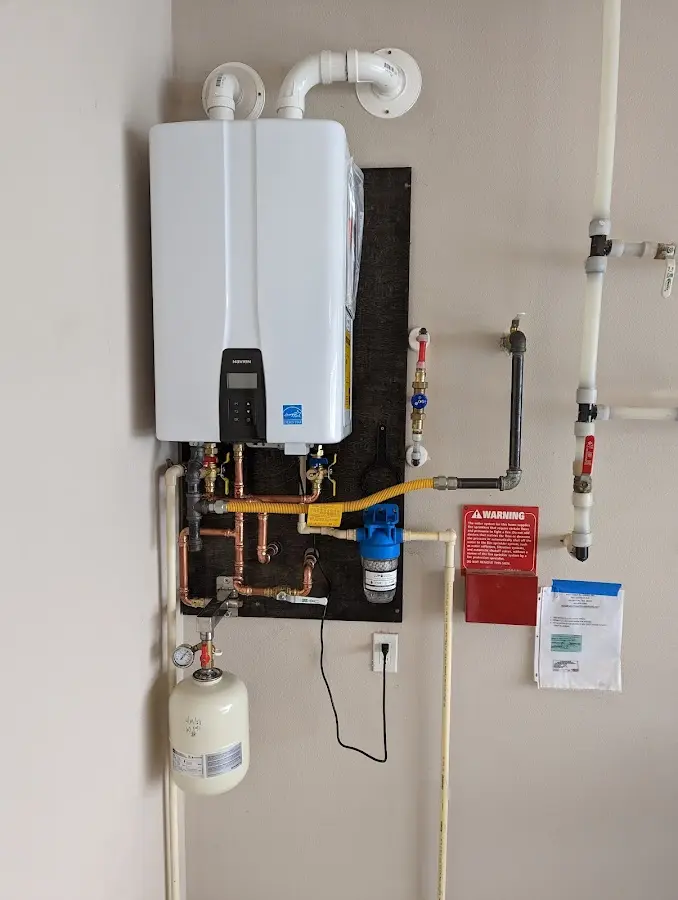 Professional plumber installing copper piping in a Hallandale Beach home